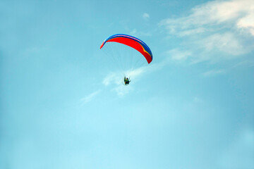 paratroopers streak across the sky