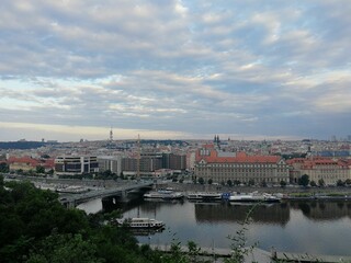 Fototapeta na wymiar Aerial view of the skyline of Prague near the Vltava River under a bright sky
