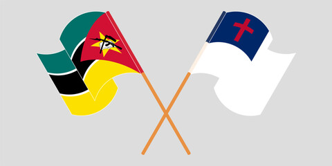 Crossed and waving flags of Mozambique and christianity