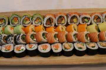 On the table in a sushi restaurant is a dish of traditional Japanese cuisine.
