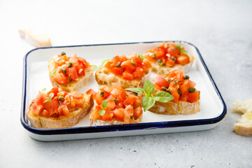 Traditional tomato bruschetta with greens