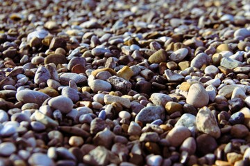 Pebbles on the beach under the sunlight