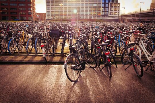 Closeup shot of bunch of bicycles parked in a main station of Amsterdam, Netherlands
