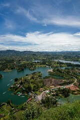 Fototapeta na wymiar Vertical aerial view of a landscape with lakes and lush vegetation in Guatape