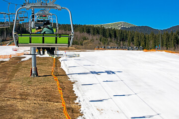 ski slope on a sunny day with a ski lift. active holiday with family