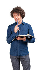 A curly-haired man holding a notebook and a pen, thinking, dressed in casual clothing, isolated on...