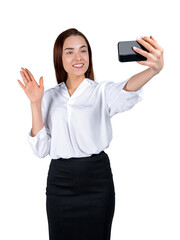 A smiling woman taking a selfie with a phone, waving with one hand, isolated on white background, depicting communication concept