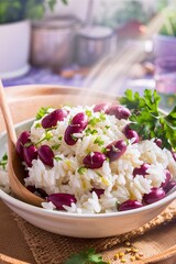 Rice with red beans with fresh parsley in a bowl