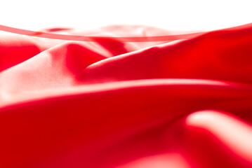 The bright red silk satin surface is beautiful and luxurious, wavy. For background and graphic work Blurry or blurry