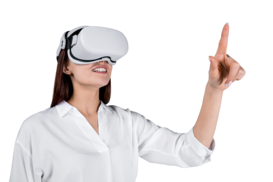 A woman in a white shirt wearing virtual reality goggles, pointing upwards, isolated on a white background, concept of modern technology - Powered by Adobe