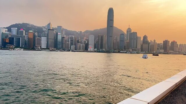 Victoria Habour, Hong Kong - Apir 14th 2024 - VDO of Bustling harbour area with waterfront scenery and popular nighttime light.