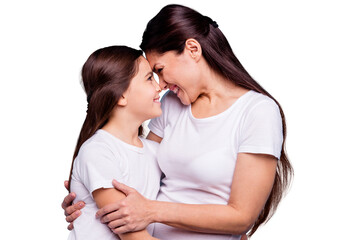 Close up photo adorable amazing pretty two people brown haired mum small little daughter stand close lovely look eyes touch foreheads rejoice wearing white t-shirts isolated on bright blue background