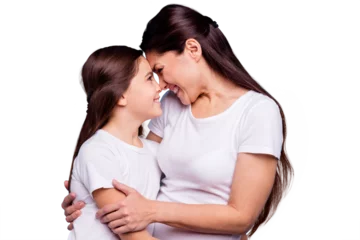  Close up photo adorable amazing pretty two people brown haired mum small little daughter stand close lovely look eyes touch foreheads rejoice wearing white t-shirts isolated on bright blue background © deagreez