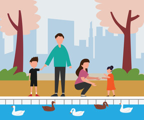 Happy family with kids in city park, feeding ducks in pond water