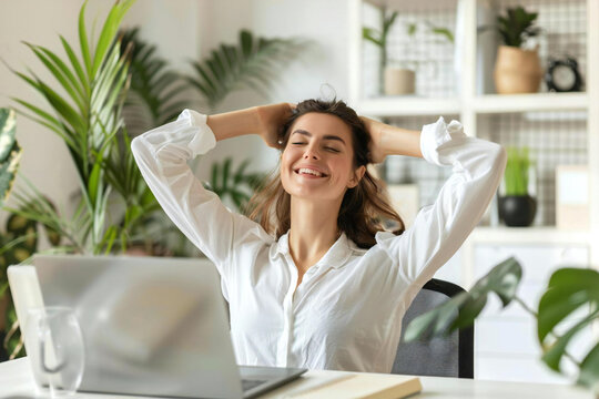 Woman doing office exercise stretch in workplace technology