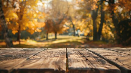 Naklejka na ściany i meble An autumn backdrop frames an unoccupied wooden table