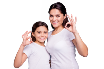 Close up photo beautiful two people brown haired mom little daughter hugging best friends look similar show okey symbol with fingers hands arms wearing white t-shirts isolated bright blue background