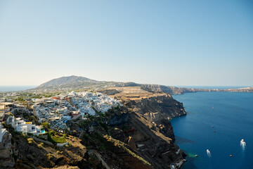 Panoramic view of Thira (Fira), the capital city of Santorini, greek village situated on the cliff, Santorini Island, Cyclades, Greece