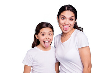 Fototapeta premium Close up photo beautiful two people brown haired mom little daughter friends hipsters silly mouth opened tongue out fooling around playing wear white t-shirts isolated bright blue background