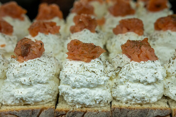 Detail of a delicious cheese appetizer with fresh tuna fillets and fine herbs