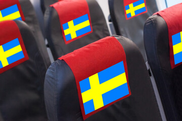 Swedish Flag on Empty seat in plane. Travel, flight and transportration in Sweden concept