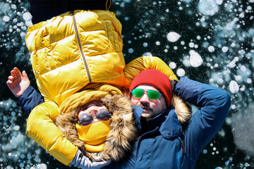 Happy couple on the frozen winter Lake Baikal
