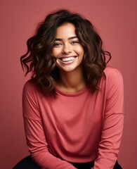 Fototapeta premium Portrait of woman, wearing a casual clothing and smiling on studio color background