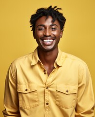 Fototapeta premium A smiling man in a yellow shirt