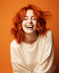 Portrait of caucasian girl, wearing a casual clothing and smiling on studio color background