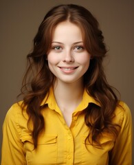 Fototapeta premium Portrait of caucasian girl, wearing a casual clothing and smiling on studio color background