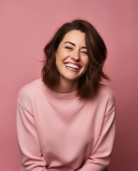Fototapeta premium Portrait of caucasian girl, wearing a casual clothing and smiling on studio color background