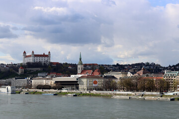 Bratislava old town panoramic view from Danube river. Bratislava castle on cloudy day. European...