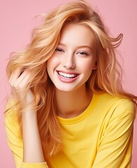 Fototapeta premium Portrait of caucasian girl, wearing a casual clothing and smiling on studio color background