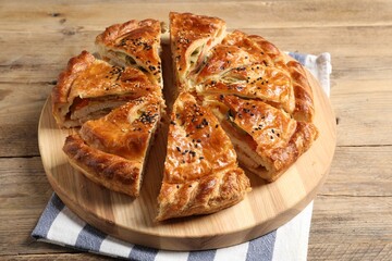 Cut delicious homemade pie on wooden table