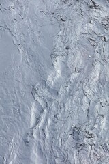 Abstract flowing river water surface pattern.