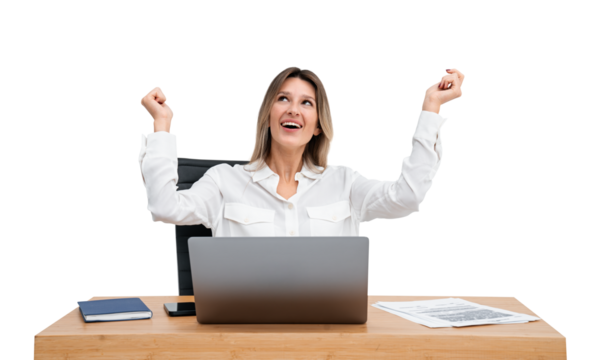 A woman in a white blouse expressing joy with raised arms, sitting at a desk with a laptop, isolated on a white background, concept of success