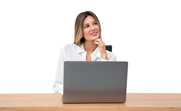 A thoughtful woman at a desk with a laptop, posed against a white background, concept of contemplation in the workplace