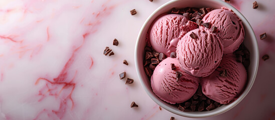 Raspberry and chocolate ice cream dessert, gelato. Sweet food. Pink icecream with berries and chocolate. Top view, pink background.	
