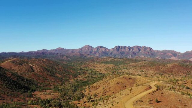 Aerial flying from Razorback lookout as landscape view of Flinders ranges - Wilpena Pound rock formation.
