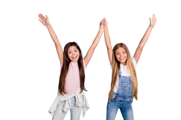 Portrait of nice cool cute lovely sweet charming dreamy attractive cheerful straight-haired pre-teen girls siblings holding hands up enjoy party isolated over blue turquoise background