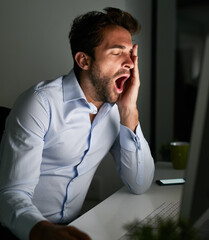 Business man, tired and yawn at desk with computer for programming, coding at night and burnout in...