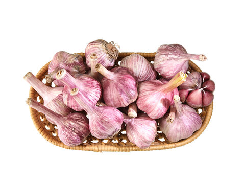 A basket of garlic on white background