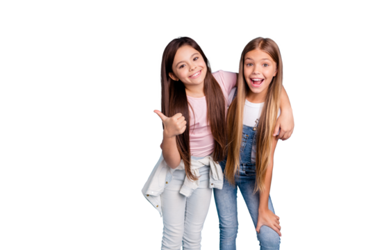 Portrait of two people nice cute lovely charming dreamy attractive cheerful straight-haired pre-teen girls siblings showing aside ad promotion copy space isolated on blue turquoise background