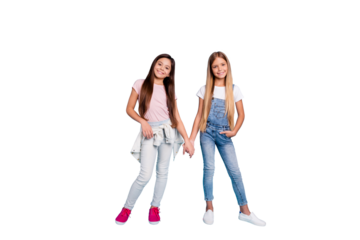 Full length body size view portrait of two people nice cheerful friendly kind straight-haired pre-teen girls holding hands spending free time trust support isolated on blue turquoise background