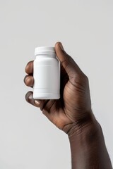 Hand Holding Blank Pill Bottle Mockup on White Background, Pharmaceutical Product Packaging, Branding and Advertising