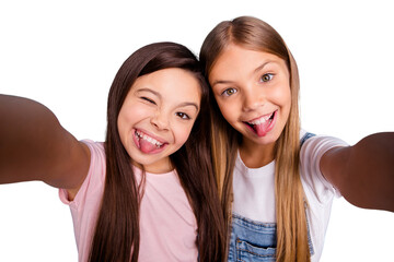 Close up photo two pretty little age girls holiday having fun funky childish glad tongue out of...