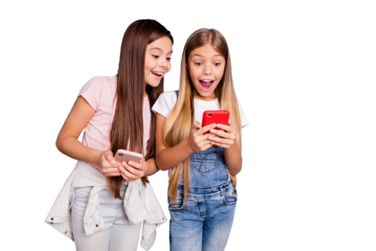 Close up photo two people little she her blond brunette girls long pretty hair telephone hands arms look open mouth wow face wearing casual jeans denim t-shirts isolated blue bright background