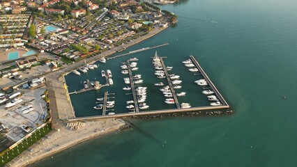Aerial view Yacht Club. Italy, Peschiera del Garda, Lake Garda. Moored yachts and motorized private...