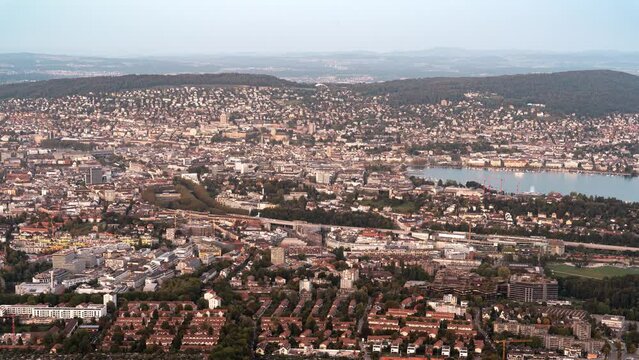 Zurich old town and lake in Switzerland. Day to night time lapse seen from Uetliberg viewpoint