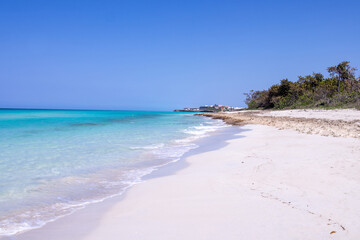 The beautiful beach front of the Cuban town of Varadero in Cuba showing the sandy beach on a sunny summers day